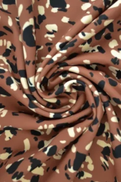 Lycra - Black and Beige Panther Spots on Light Brique